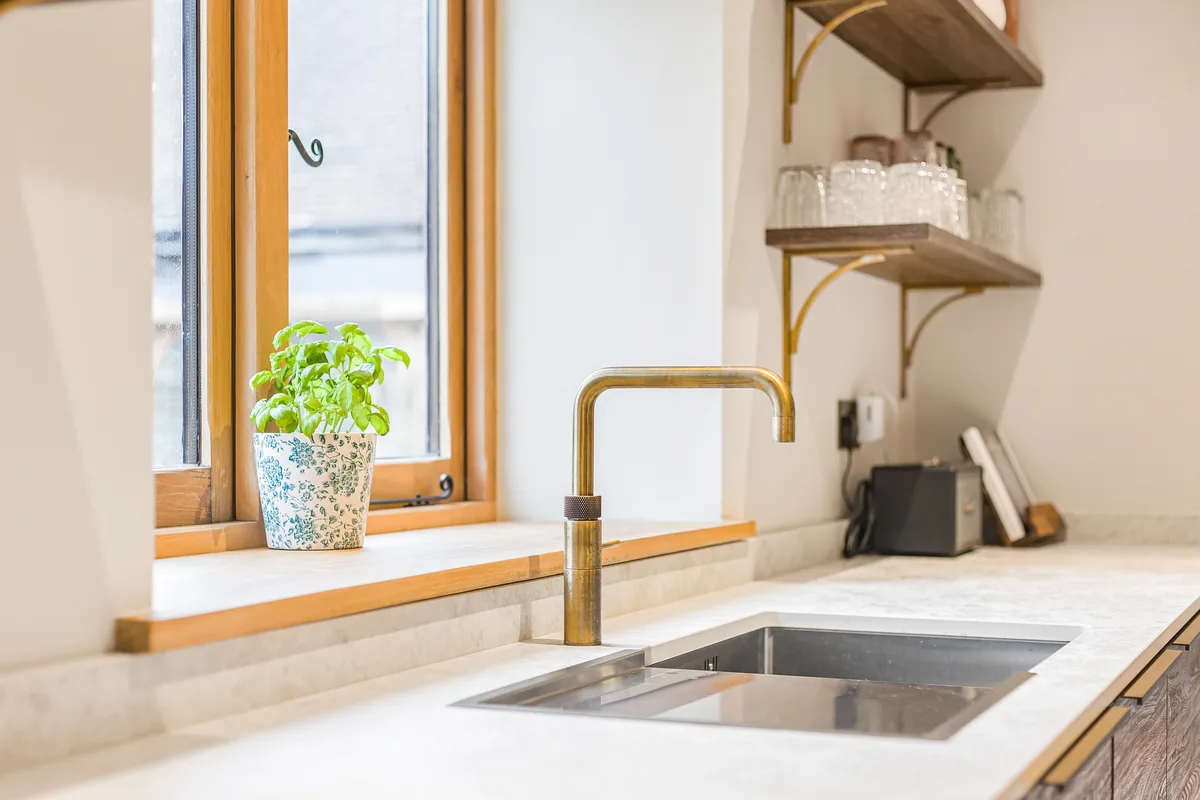 Brass tap and stone worktop detail from the Barn Conversion