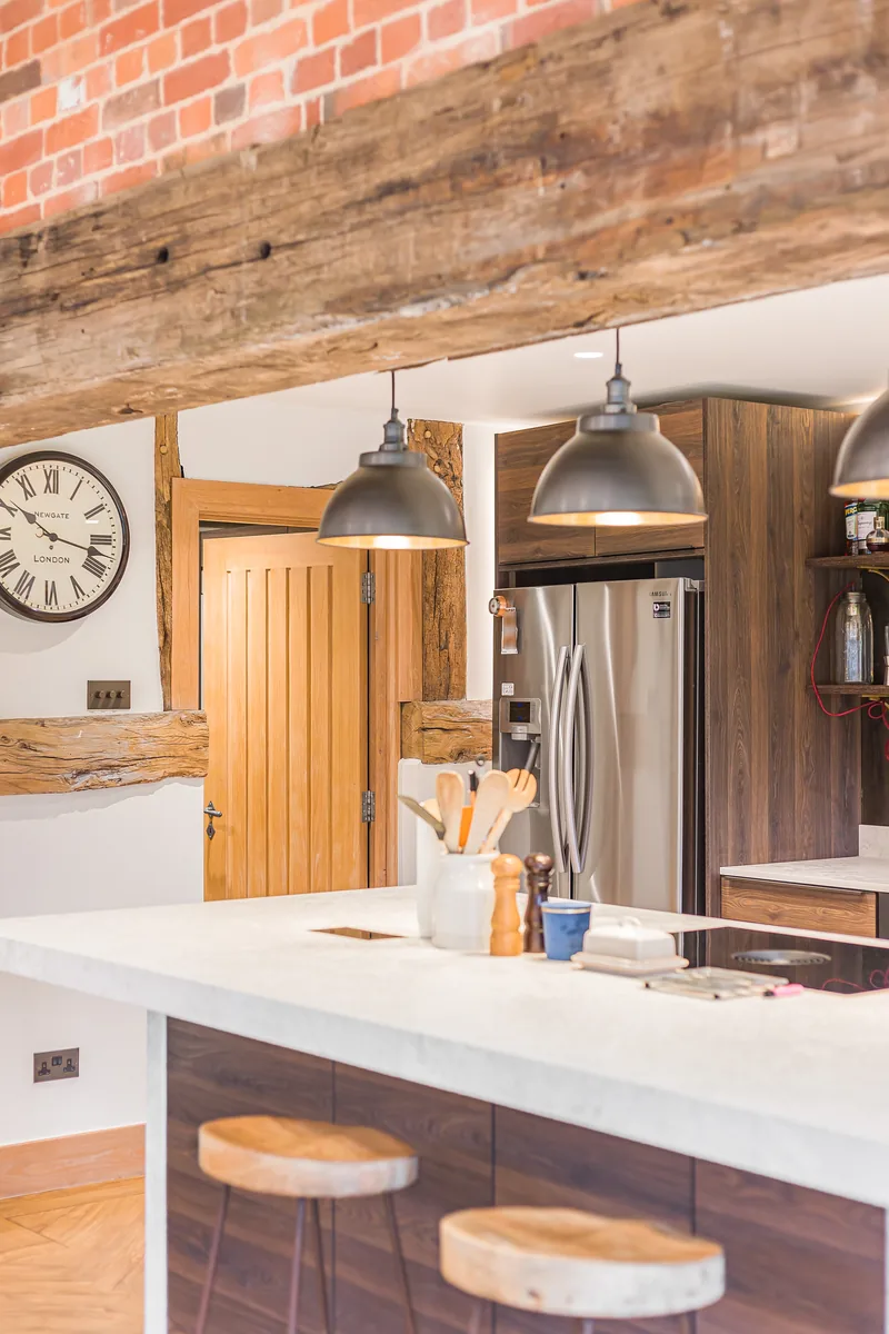 Timber cabinetry, seating and bar in the Barn Conversion